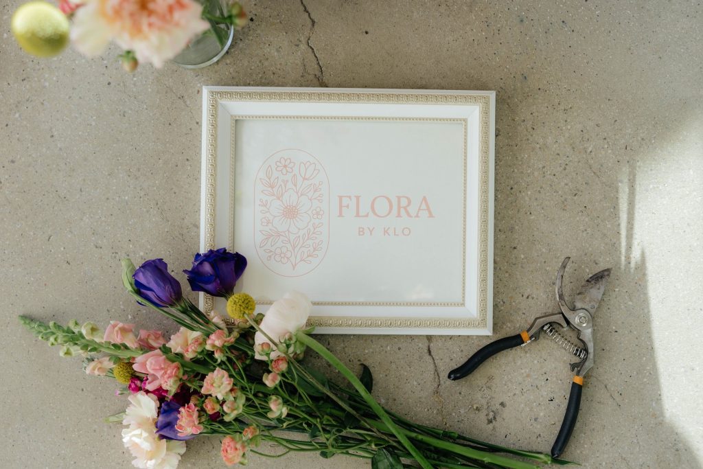 Flora by Klo sign, loose stems and floral snips