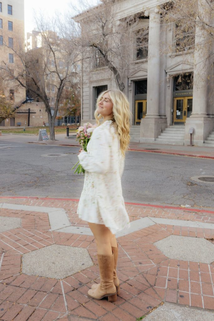 Kloe Brown with a hand-tied bouquet downtown